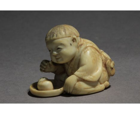 A Japanese netsuke from Meiji period circa 1870-1890. Signed Kogetsu on the base. In carved elephant tusk portraying a sat ki