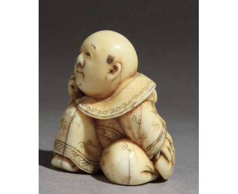 A mid 19th century Japanese netsuke from Edo period. Signed Hogyoko on the base. On carved elephan ttusk portrayinf a child s