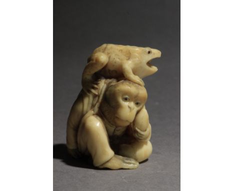 A 19th century Japanese netsuke. Signed Gyokushun on the base. In carved elephant tusk portraying a toad resting on the back 