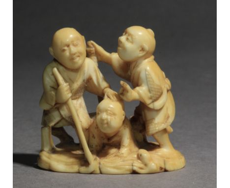 A late 19th century Japanese netsuke-okimono from Meiji period. Signed Tsugukazu on the base. In carved elephant tusk portray