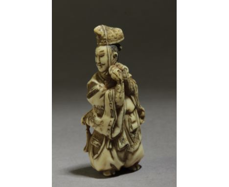 A 19th century Japanese netsuke from Edo period. Signed Shosai on the base. In carved elephant tusk portraying a courtier lac