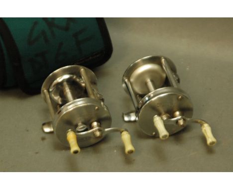 2 multipliers, Shakespeare Wonder Reel No. 1915 and South Bend No. 20 Model B, and a Neoprene pouch. 