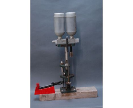 A W.J. Bowman & Sons reloading station and a part Lee powder scale. 
