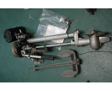 A Seagull vintage outboard motor, with instructions and an anchor.