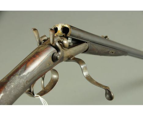 An E.M. Reilly & Co. 36 x 2 1/4 Cal. double hammer rifle, with 26" barrels, barrels inscribed "E.M. Reilly & Co., New Oxford 