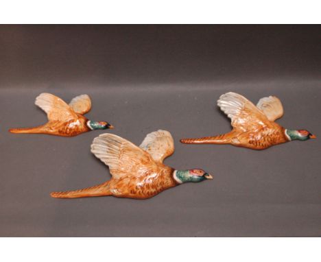 Three Beswick graduated wall hanging flying pheasants, Model No. 661. 