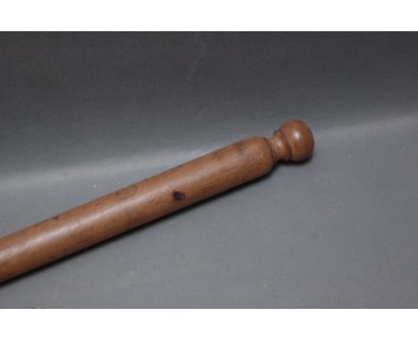 A turned hardwood walking stick, heavy gauge, with copper ferrule.  Length 95 cm. 