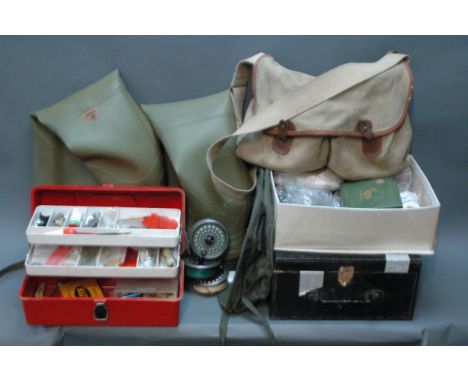 A collection of vintage fishing tackle, to include a Brady canvas and leather bag, fly tying materials, a red tackle box cont