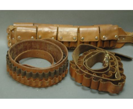Three leather ammunition belts, shotgun and rifle. 