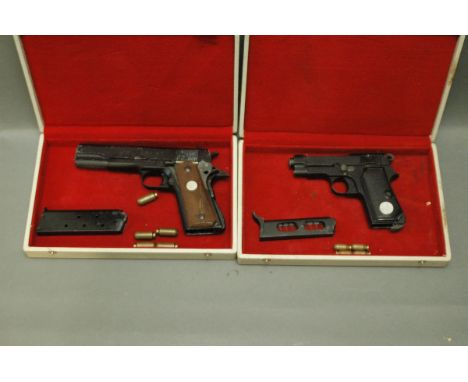 2 replica handguns, Italian Model M-1934-67 and a Colt 1911 A1-67 US Army model.