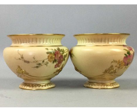 FOUR ROYAL WORCESTER BLUSH IVORY VASES,comprising two pairs, the taller no. 1735, 9.4cm high, the smaller No. 991, all floral