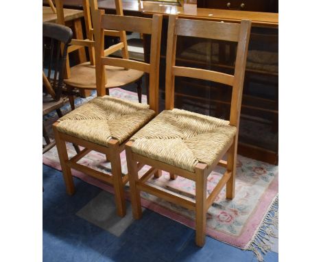 A Pair of Rush Seated Pine Ladder Back Chairs 