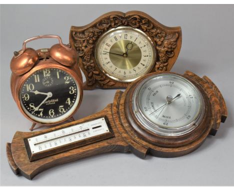 An Edwardian Oak Aneroid Wheel Barometer, 1950's Mantle Clock and a Copper Alarm Clock 