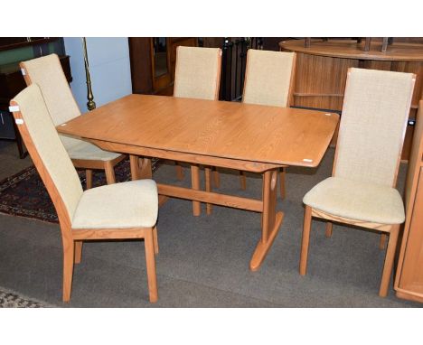 An Ercol light elm extending dining table, 150cm by 92cm closed, together with a set of six matching dining chairs (7) 