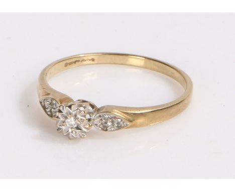 9 carat gold and diamond set ring, central diamond with three diamond chips to each shoulder, 1.6g