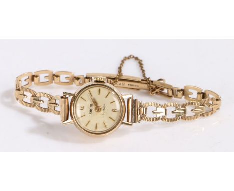 Smiths 9 carat gold ladies wristwatch, the signed white dial with baton markers, manual wound, the case 18mm wide, the caseba