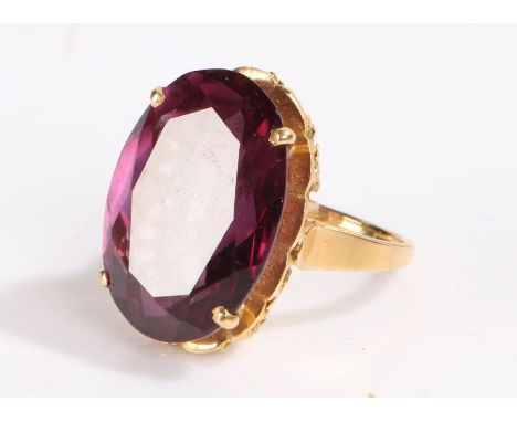 Gold coloured metal ring, set with an amethyst type stone, ring size S, 13.4g