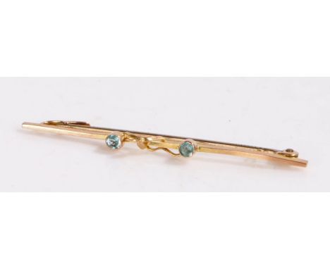 9 carat gold bar brooch with two light blue glass stones with a leaf motif, gross weight 1.2 grams&nbsp;