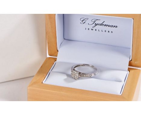 9ct and diamond white gold ring, with 16 diamonds to the head and a row to each of the shoulders, ring size N gross weight 2.