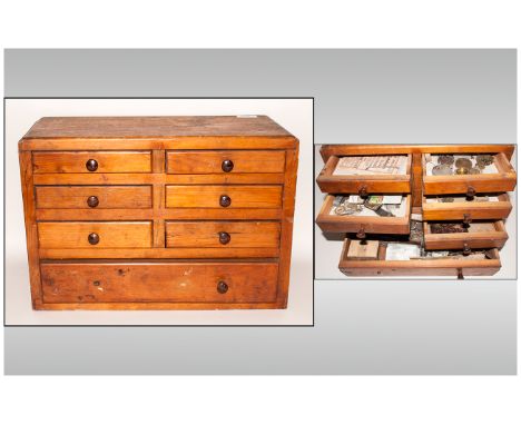 Miniature Pine Chest of Drawers housing a collection of Clock makers tools and spare parts, watches etc. 18 inches wide.