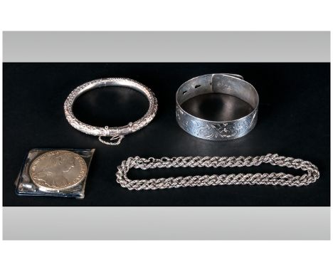 A Small Collection Of Silver Jewellery, comprising 2 silver bangles, 1 silver rope chain, 2 Maria Teresa Silver Coin, all ful
