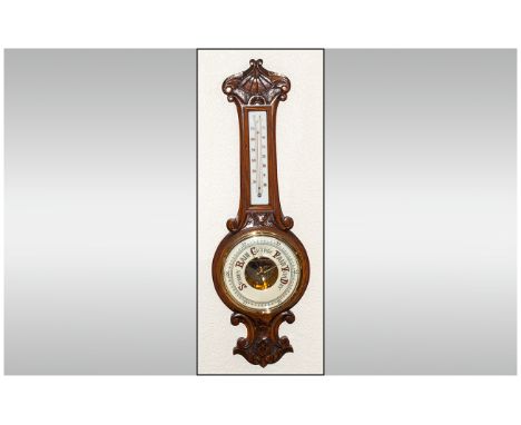 A Carved and Polished Oak Banjo Shaped Aneroid Barometer with Porcelain Dial and Thermometer. c.1920's. Excellent Condition. 