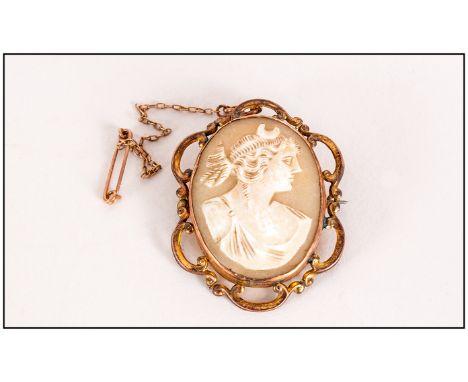 Victorian 9ct Gold Framed Oval Shaped Cameo Brooch with Openwork Border. Marked 9ct. Complete with Safety Chain. 1.75 Inches 