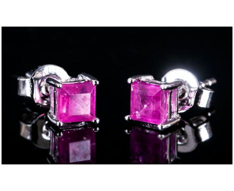 Ruby Pair of Stud Earrings, square cut rubies of 1.25cts set in rhodium vermeil and silver, with post and push back fittings 