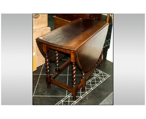 Dark Oak Wood Gate Leg Table with barley twist legs on square stretchers. 42'' in length extends to 58'' in width.