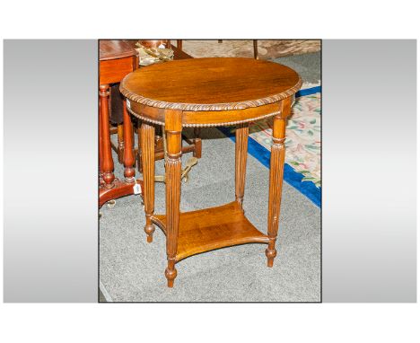 Mahogany Small Oval Shaped Top Centre Table with a carved edge, with a central draw to the side, supported on reeded legs and