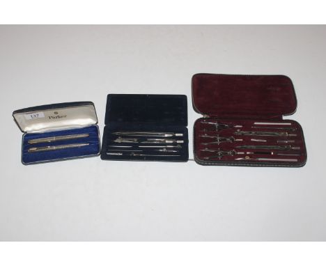 Two cases of drawing instruments and a boxed set containing sterling silver Parker pen with 14ct gold nib and sterling silver