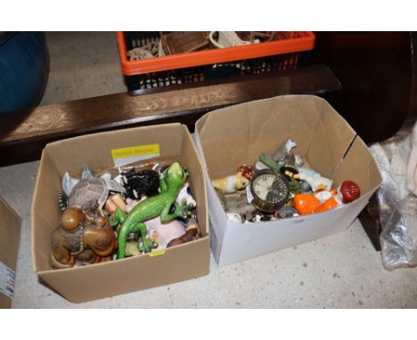 Two boxes containing various ornaments, a compass, Buddhas etc.