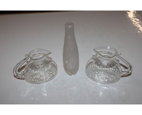 A pair of clear Art Glass Jugs and a frosted Art Glass vase