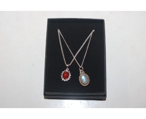 A Sterling silver fire opal pendant and chain and moonstone and Sterling silver similar 