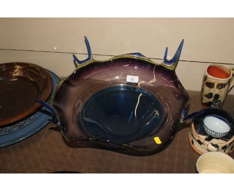 A Studio Art Glass bowl, in blue yellow and amethyst colours singed to base, approx. 38cm dia. 