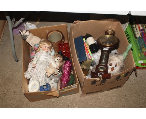 Two boxes containing cat and dog ornaments, collectors doll from the Classique Collection, a barometer, a battery operated ma