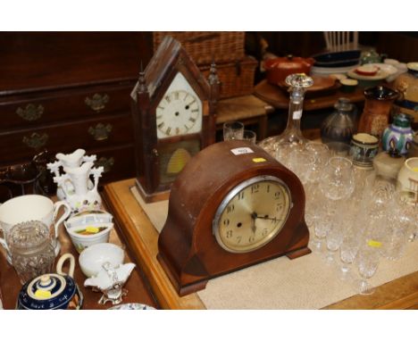 An Edwardian Enfield chequer banded inlaid two hole mantel clock and an antique Gothic style rosewood steeple shelf mantel cl