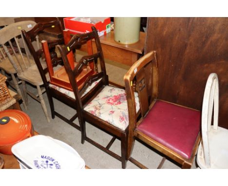 A pair of ladder back dining chairs; a small coffee table and a slat back dining chair 