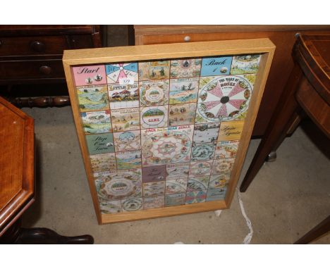 A glazed nursery games poster in light oak frame
