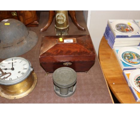 A Georgian sarcophagus shaped tea caddy; and a pewter mould 