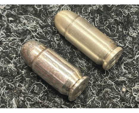 Colt .45 Auto Solid Silver Bullets x 2. One marked "1oz, 999 AG" and the other marked "NWTM 1oz, 999 AG". (North West Territo
