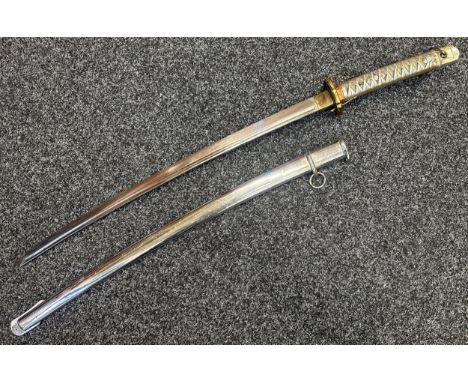 WW2 Japanese NCO's Shin Gunto Sword with single edged fullered blade 690mm in length, serial number 130842. Brass Tsuba. Copp
