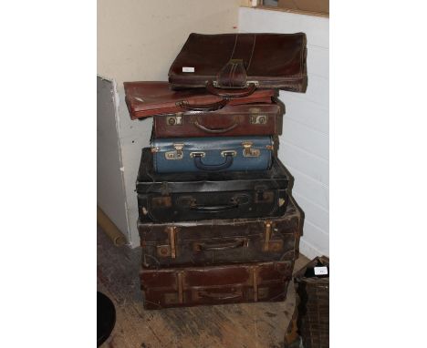 A job lot of vintage suitcases etc 