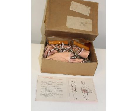 A vintage boxed exercise aid 