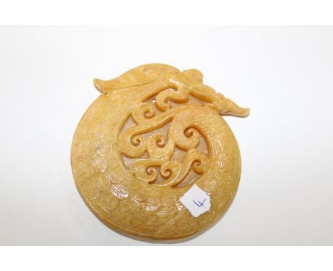 A finely carved yellow jade pendant 