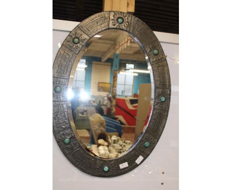 A vintage Arts &amp; Crafts bevelled edged mirror with hand beaten decoration 75cm x 56cm collection only 