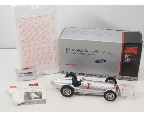 A CMC M-099 1/18 scale diecast Mercedes W154 (1938) Trainingsfahrzeug GP Frankreich race car, with original tag and paperwork