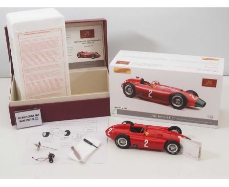 A CMC M-185 1/18 scale diecast Ferrari D50 race car, 1956 long nose, GP Germany #2 Peter Collins, with original tag, accessor