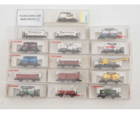 A group of N gauge wagons by FLEISCHMANN and TRIX, including a twin pack and a Swiss special edition - VG/E in VG boxes (16 w