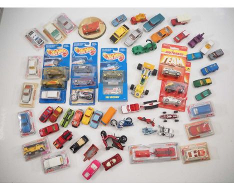 A group of boxed and unboxed diecast cars to include carded examples by MATTEL HOTWHEELS and boxed/carded examples by MAJORET